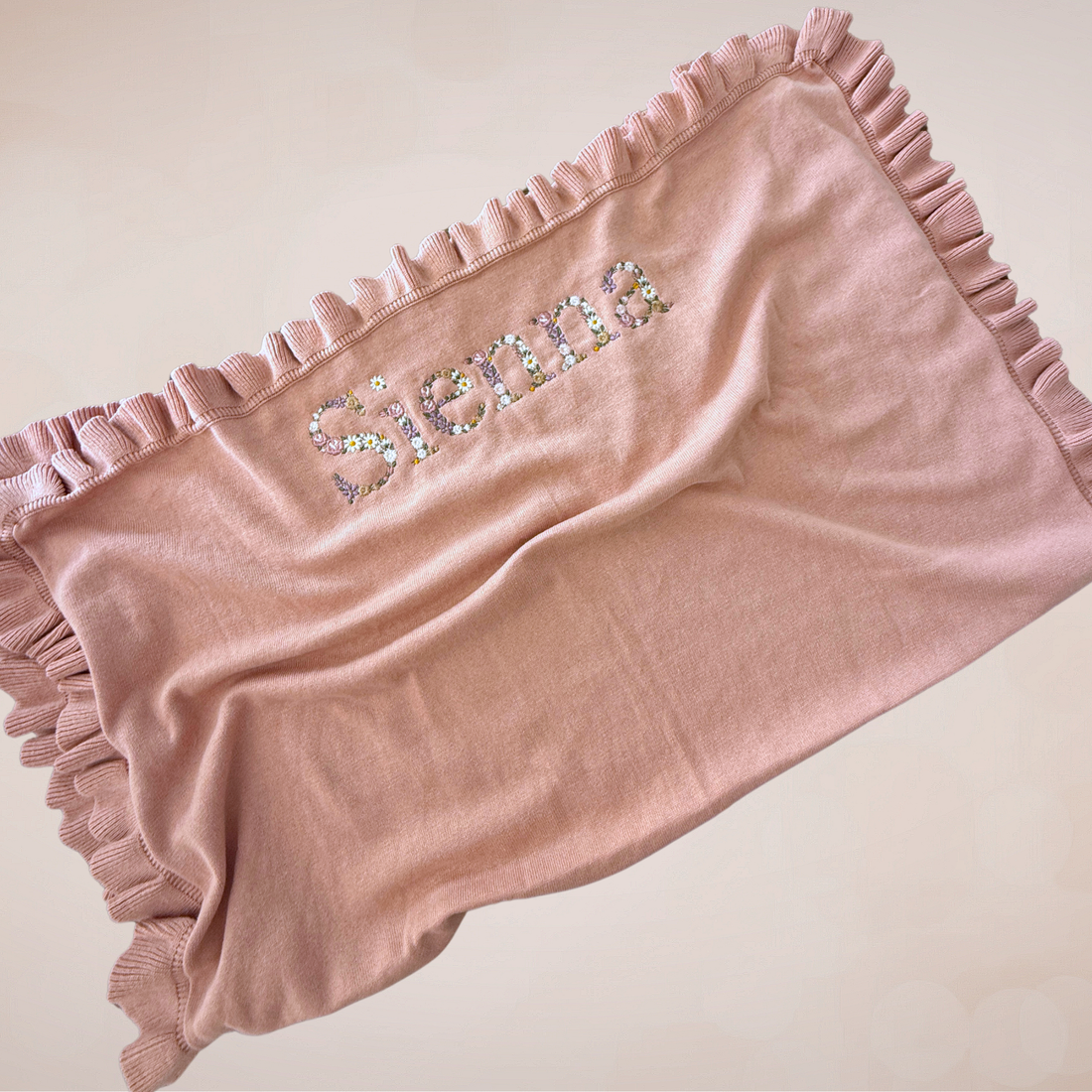 Floral embroidered ruffle blanket- Large font