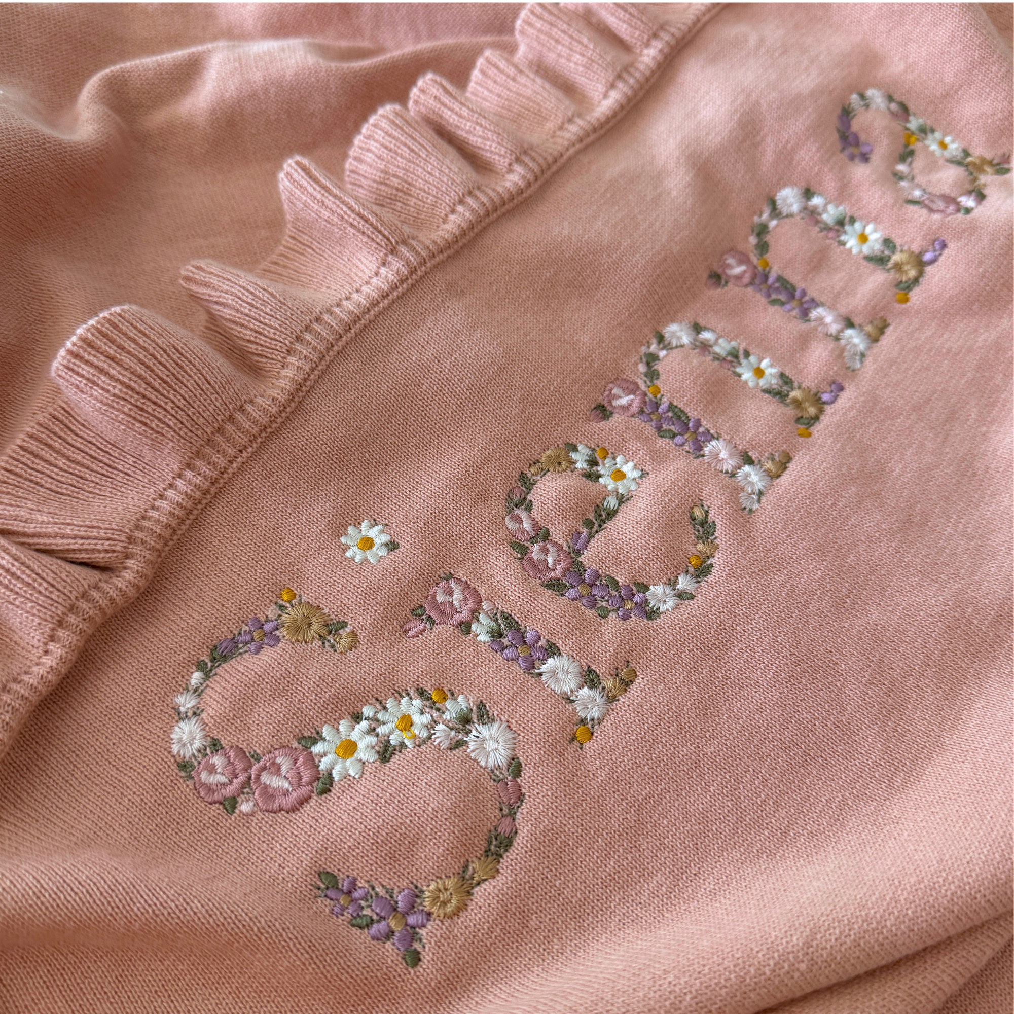 Floral embroidered ruffle blanket- Large font